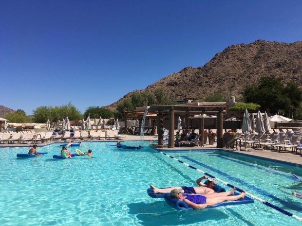 Hotel guests cool off at the pool at the JW Marriott Scottsdale Camelback Inn Resort and Spa in Paradise Valley, Ariz., on Sunday, June 19, 2016. States in the Southwest are in the midst of a summer heat wave as a high pressure ridge bakes Arizona, California and Nevada with extreme, triple-digit temperatures. (AP Photo/Anna Johnson)