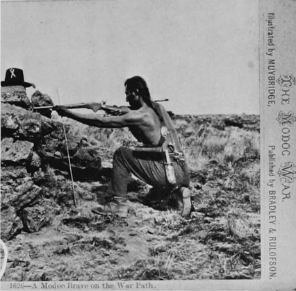 Seeking an image of a Modoc fighter and figuring that one Native looked pretty much like any other, Muybridge posed Warm Springs scout Loa-kum Ar-nuk. The photographer put the scout down sighting a Spencer carbine steadied by a shooting stick. This image from the left shows the scouts knife hanging from his belt, a blend of the savage old with the civilized new of the repeating rifle.
