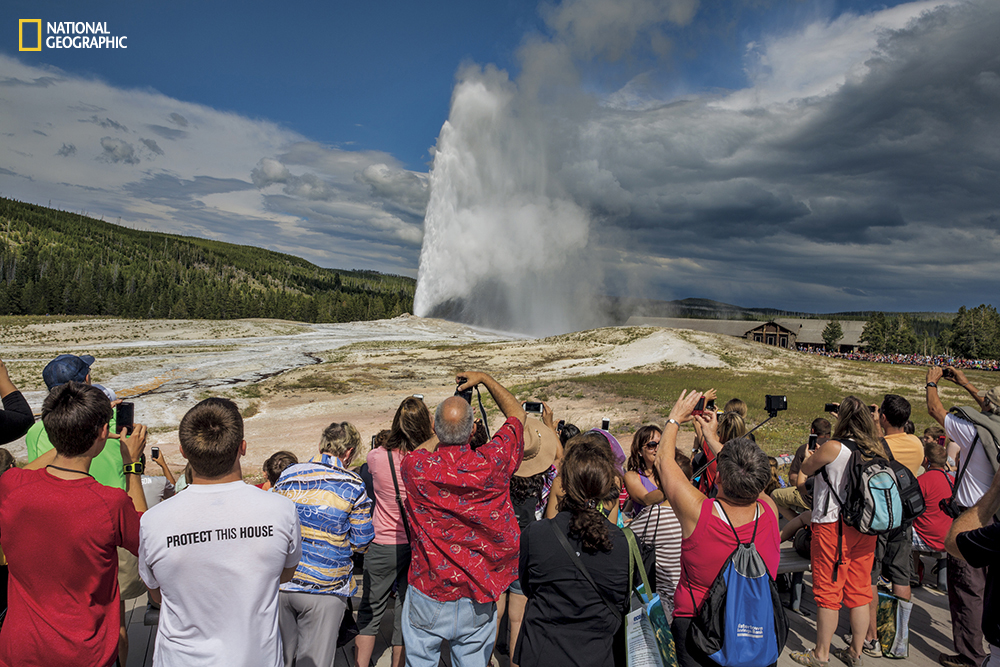 Almost like clockwork, every 60 to 110 minutes, Old Faithful shoots out a jet of steam and hot water up to 184 feet high. In summer the nearby parking lot fills and empties at about the same pace. (Photo from the May 2016 issue of National Geographic magazine/Michael Nichols/National Geographic)