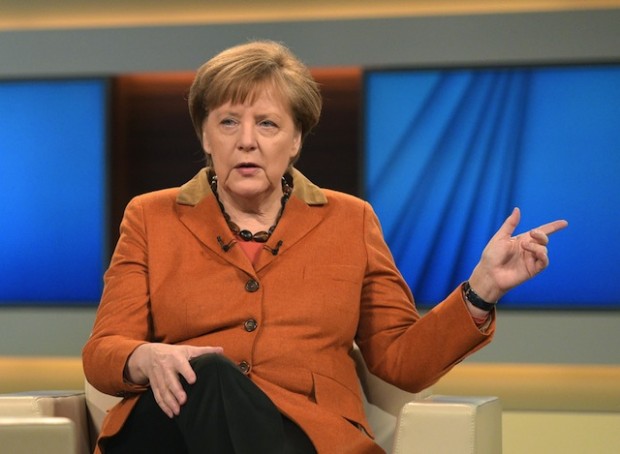 German Chancellor Angela Merkel gestures as she poses before a TV interview on the migrant crisis with public broadcaster ARD, on February 28, 2016 in Berlin. Merkel said during this interview that the EU cannot allow Greece, a country bailed out from its huge debt crisis, to plunge into "chaos" by shutting European borders to refugees. (Rainer Jensen/AFP/Getty Images)
