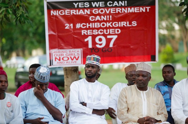 People attend the daily Bring Back Our Girls campaign in Abuja, Nigeria, Friday, Oct. 14, 2016. Conflicting reports emerged Friday about whether the first negotiated release of some Chibok schoolgirls kidnapped by Boko Haram in Nigeria in 2014 involved a ransom payment, a prisoner swap for Islamic extremist commanders, or both. (AP Photo/Sunday Alamba)