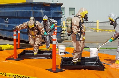 In this June 27, 2016 photo provided by the Royal Canadian Mounted Police, members of the RCMP go through a decontamination procedure in Vancouver after intercepting a package containing approximately 1 kilogram (2.2 pounds) of the powerful opioid carfentanil imported from China. Cocaine or heroin, we know what the purpose is, said Allan Lai, an officer-in-charge at the Royal Canadian Mounted Police in Calgary, who is helping oversee the criminal investigation. With respect to carfentanil, we dont know why a substance of that potency is coming into our country. (Royal Canadian Mounted Police via AP)