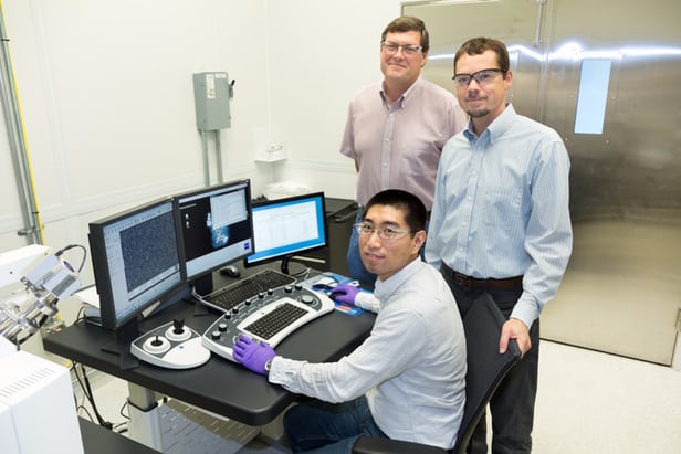 The ORNL researchers involved in the CO2-to-ethanol conversion research: Yang Song (seated), Dale Hensley (standing left)...