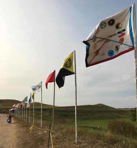 The flags of many Nations fly together at Standing Rock. (Photo: Courtesy Steven Sitting Bear/Standing Rock Sioux Tribe)