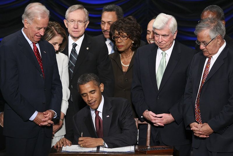 Barack Obama signs the Dodd-Frank Wall Street Reform and Consumer Protection Act on July 21, 2010. Photographer: Win McNamee/Pool via Bloomberg