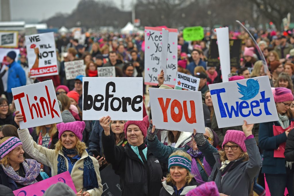 Demonstrators protest on the National Mall in Washington, DC, for the Women's March on January 21, 2017. Hundreds of thousands of protesters spearheaded by women's rights groups demonstrated across the US to send a defiant message to US President Donald Trump. / AFP / Andrew CABALLERO-REYNOLDS        (Photo credit should read ANDREW CABALLERO-REYNOLDS/AFP/Getty Images)