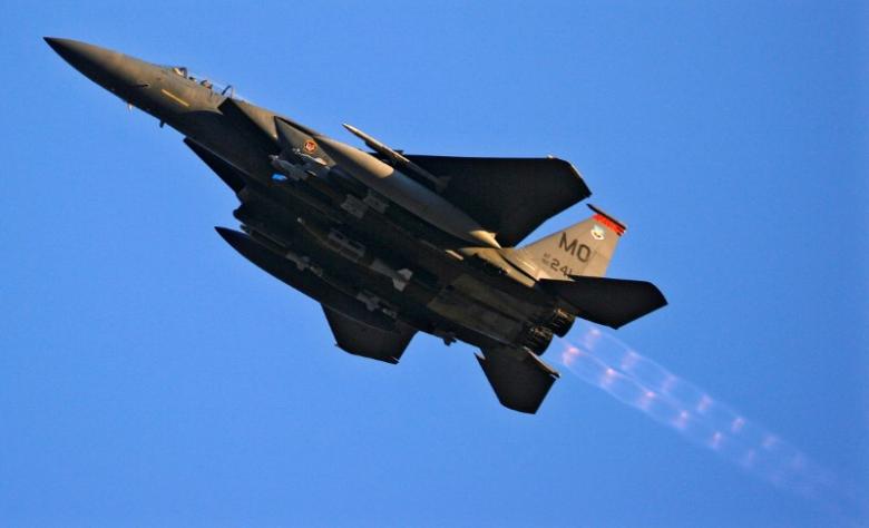 FILE PHOTO: A U.S. Air Force F-15 fighter jet does a low-level flyby over Forward Operating Base Bostick in eastern Afghanistan January 1, 2009. REUTERS/Bob Strong/File photo