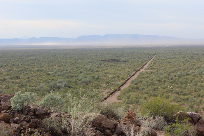 Tohono Oodham Nation on the left of border wall area, with Mexico on the right