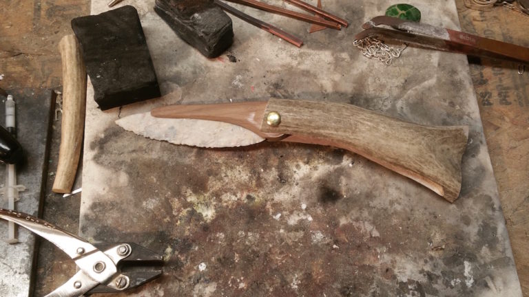 Seth Joness latest breakaway pocketknife design updates ancient technology for modern needs, with a super-sharp chert blade folding into an antler handle via a brass hinge. Jones makes stone blade knives that he uses and sells.