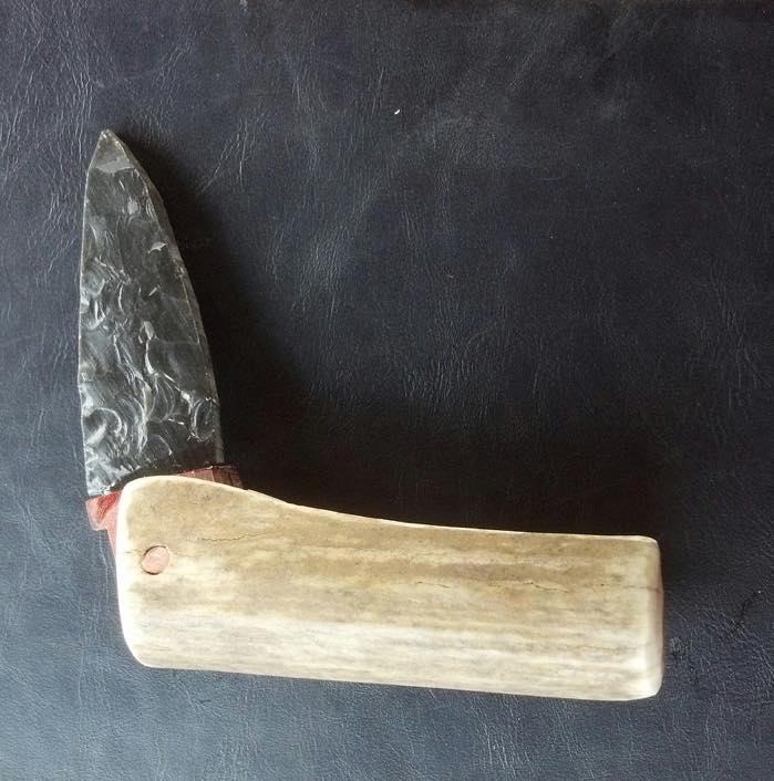 Seth Jones made this pocketknife with an obsidian blade that folds into an antler handle. Jones makes stone blade knives that he uses and sells.